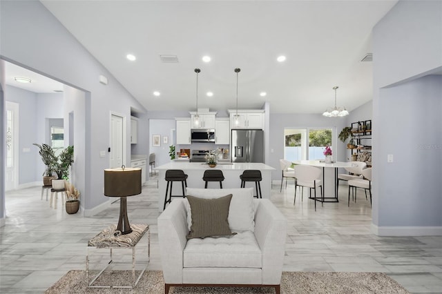 living room with visible vents, recessed lighting, and baseboards