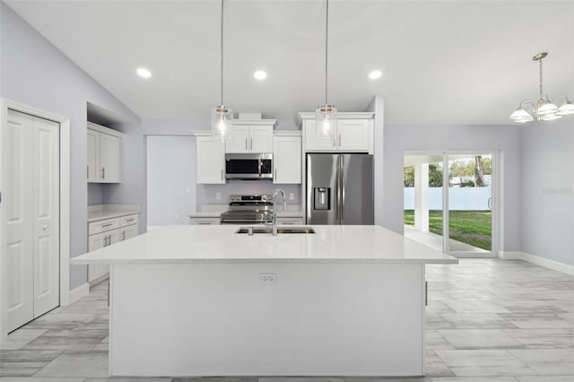 kitchen featuring a sink, light countertops, white cabinets, and stainless steel appliances