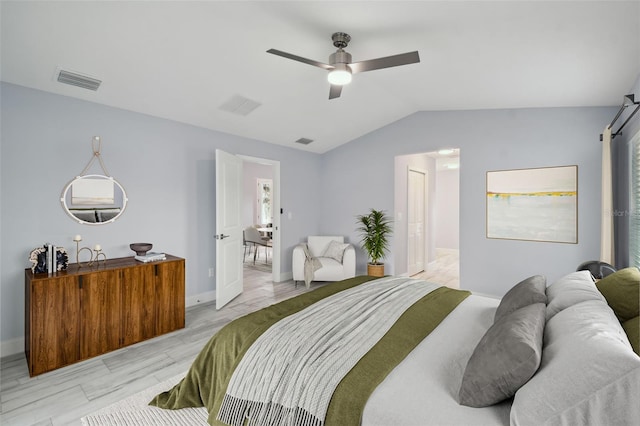 bedroom featuring vaulted ceiling, a ceiling fan, visible vents, and baseboards