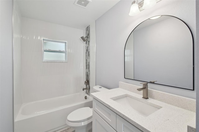 bathroom featuring visible vents, shower / washtub combination, toilet, and vanity