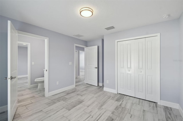 unfurnished bedroom with visible vents, baseboards, and a closet