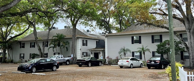 5221 Bayshore Blvd Unit 29, Tampa, FL 33611 - view of front of property featuring a shingled roof and stucco siding