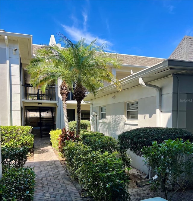 view of side of home featuring stucco siding