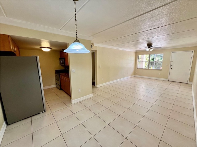 5221 Bayshore Blvd Unit 29, Tampa, FL 33611 - kitchen featuring light tile patterned floors, a ceiling fan, open floor plan, and stainless steel appliances
