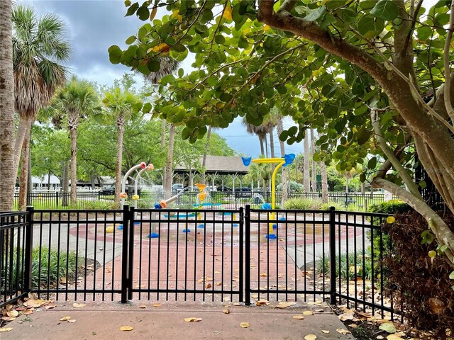 5221 Bayshore Blvd Unit 29, Tampa, FL 33611 - view of gate featuring fence