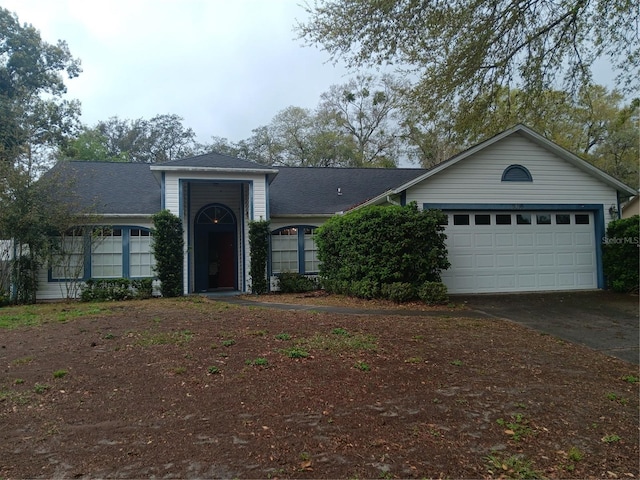 ranch-style house featuring driveway and a garage