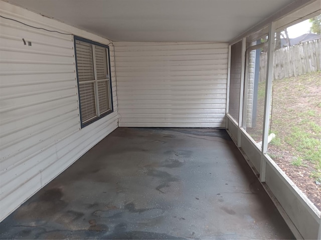 unfurnished sunroom with a wealth of natural light