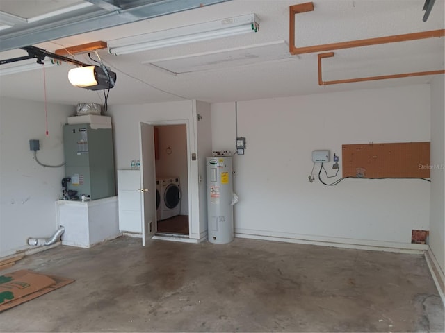 garage featuring washer and dryer, heating unit, a garage door opener, and water heater