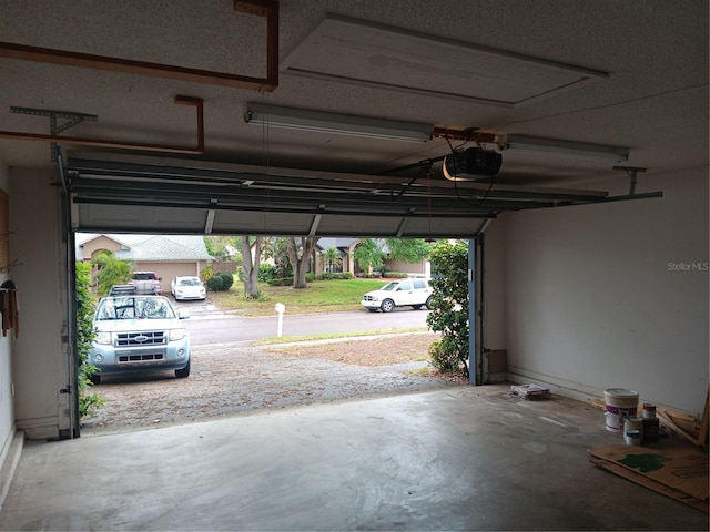 garage featuring a garage door opener