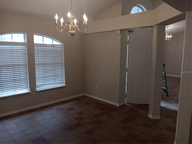 unfurnished dining area featuring baseboards, lofted ceiling, and a chandelier