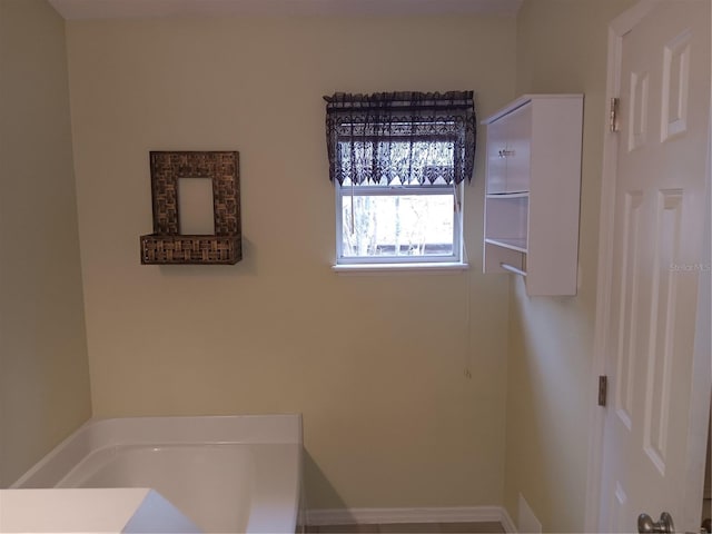 bathroom featuring a garden tub