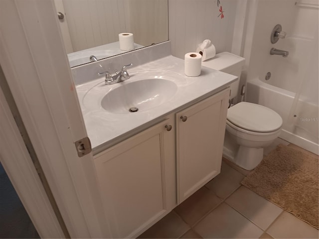 full bath featuring shower / bathing tub combination, toilet, vanity, and tile patterned flooring