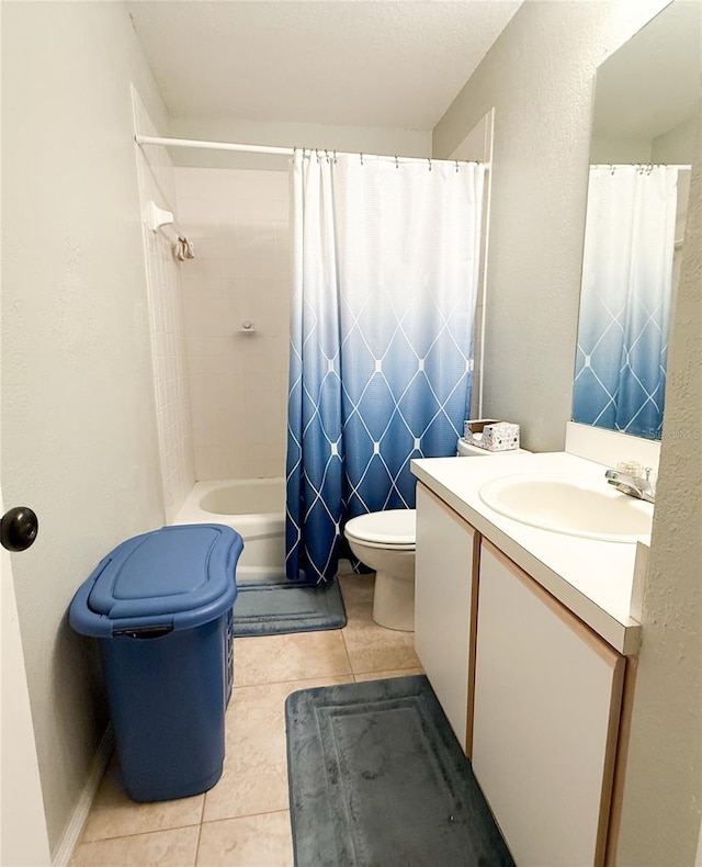 bathroom featuring toilet, shower / bath combination with curtain, vanity, and tile patterned flooring