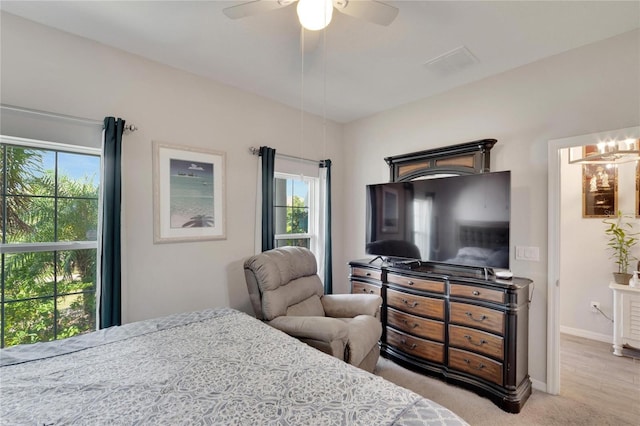 bedroom with visible vents, baseboards, and a ceiling fan