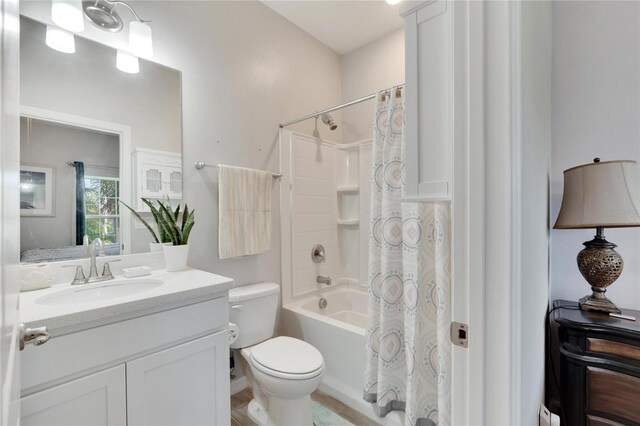 full bath featuring vanity, toilet, baseboard heating, and shower / tub combo