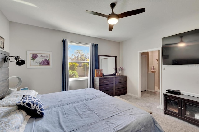 bedroom featuring baseboards, light carpet, and ceiling fan