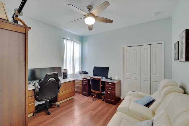 office space featuring a ceiling fan and light wood finished floors