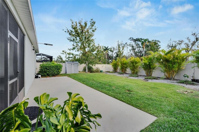 view of yard featuring a patio and a fenced backyard