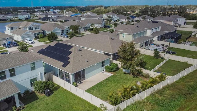 birds eye view of property with a residential view