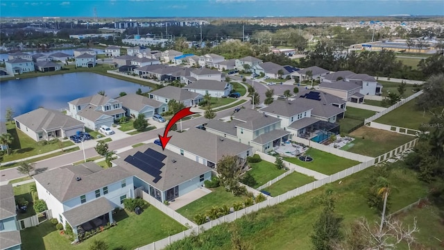 birds eye view of property featuring a residential view and a water view