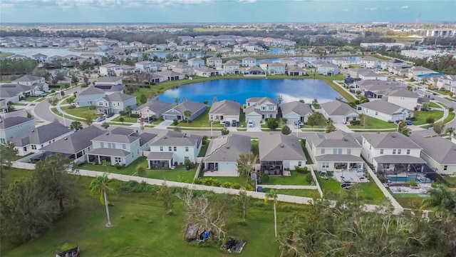 bird's eye view featuring a residential view and a water view