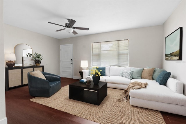 living room featuring a ceiling fan and wood finished floors