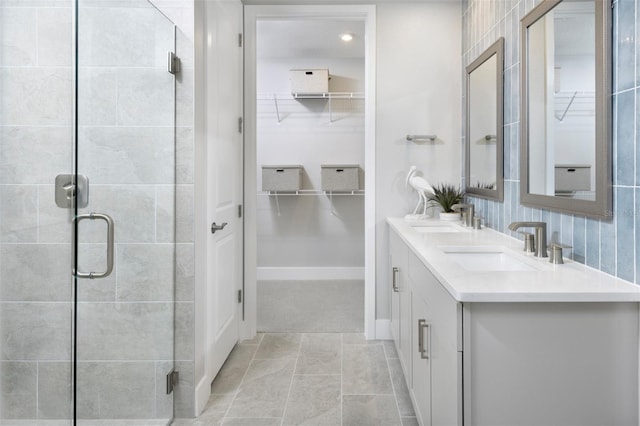 17420 Moonflower Dr Unit 101, Venice, FL 34293 - full bath with a spacious closet, double vanity, a sink, and a shower stall