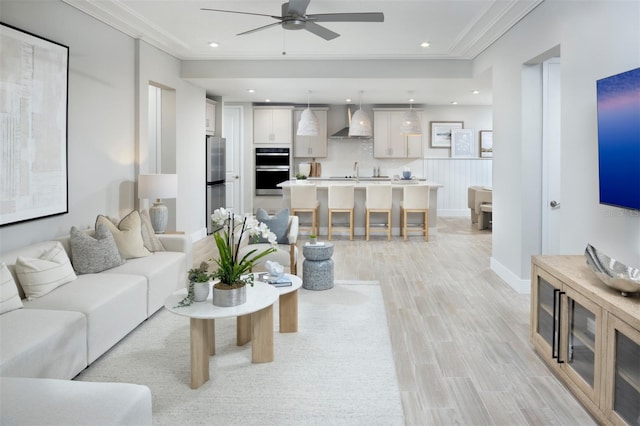 17420 Moonflower Dr Unit 101, Venice, FL 34293 - living area featuring crown molding, baseboards, recessed lighting, a ceiling fan, and light wood-style floors