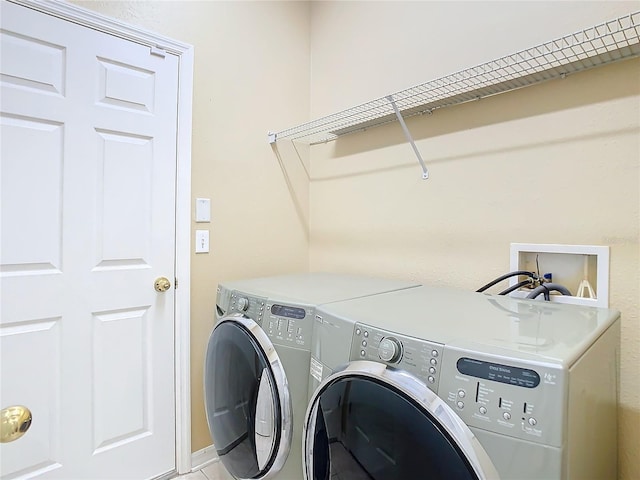 laundry room featuring laundry area and washing machine and dryer