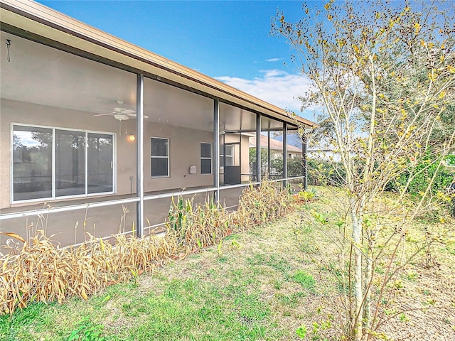 view of yard featuring a sunroom