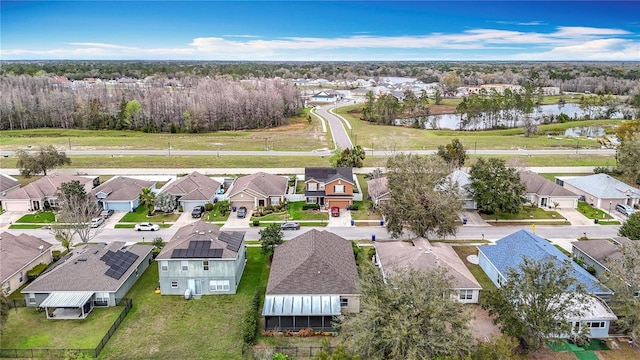 birds eye view of property with a residential view and a water view