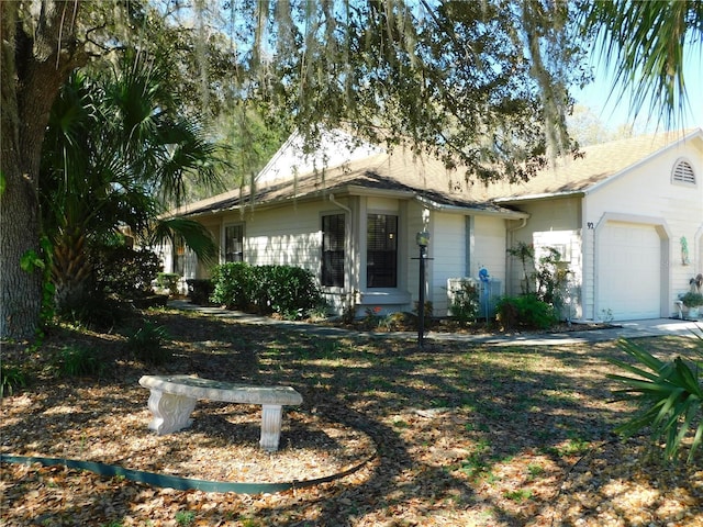 single story home featuring a garage