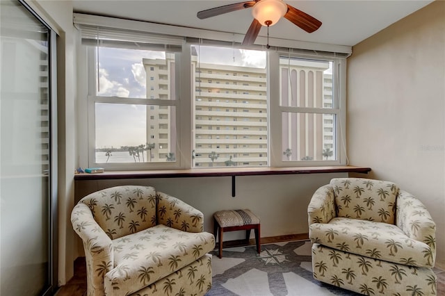 living area featuring ceiling fan