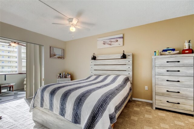 bedroom with baseboards, carpet floors, and a ceiling fan