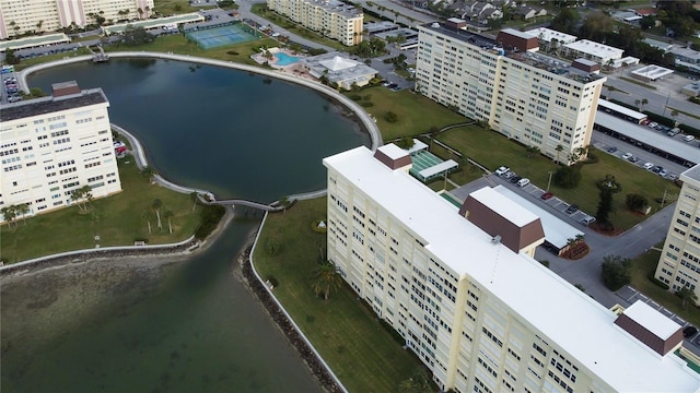 drone / aerial view with a city view and a water view