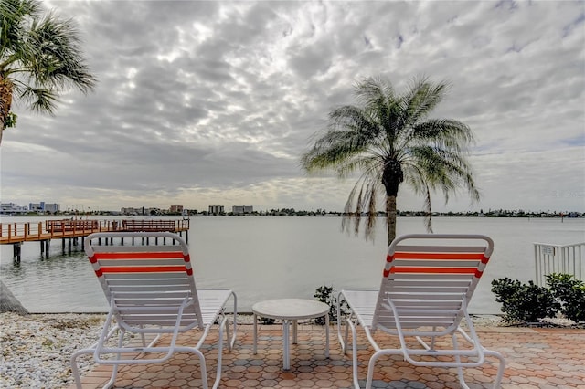 dock area featuring a city view and a water view