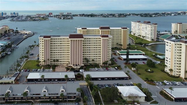 drone / aerial view with a city view and a water view