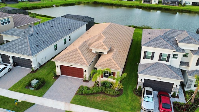 bird's eye view with a water view and a residential view