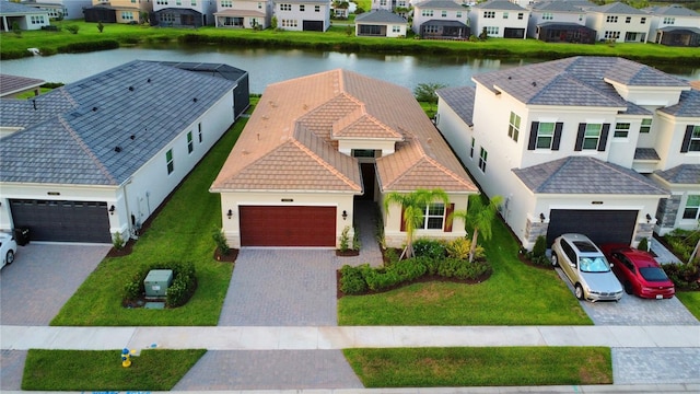 aerial view with a residential view and a water view