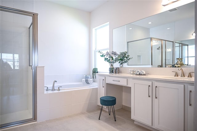 bathroom featuring visible vents, a shower stall, tile patterned flooring, a bath, and vanity