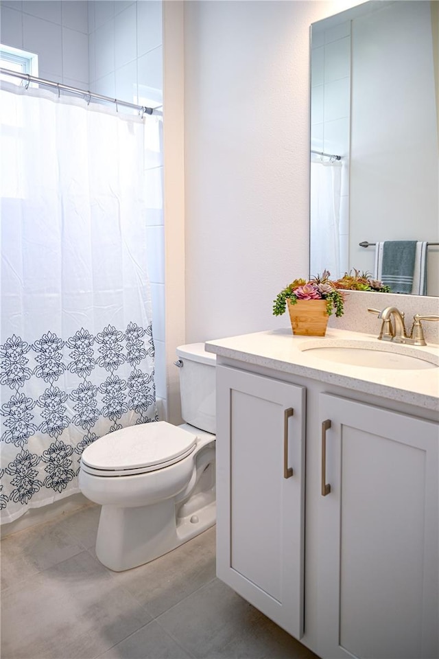 full bath featuring vanity, tile patterned floors, toilet, and a shower with curtain