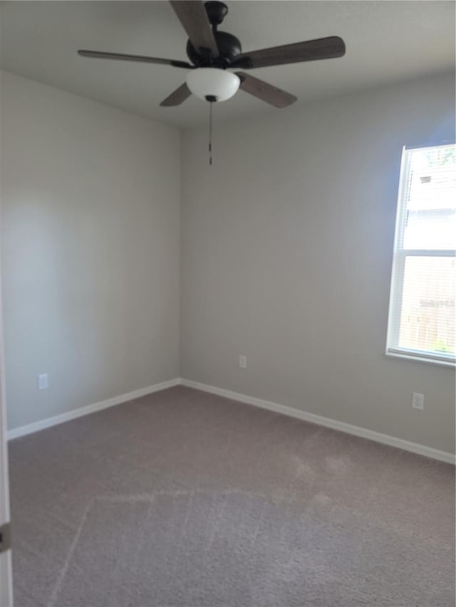 3312 Lila St, Tampa, FL 33610 - carpeted empty room featuring baseboards and ceiling fan