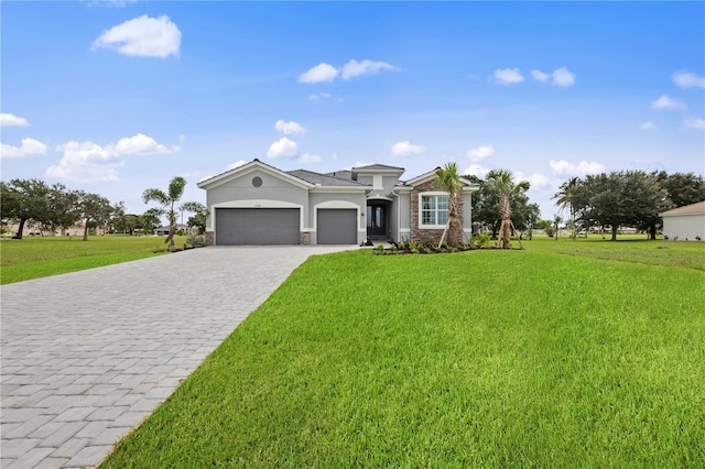 view of front of property with stucco siding, an attached garage, decorative driveway, and a front lawn