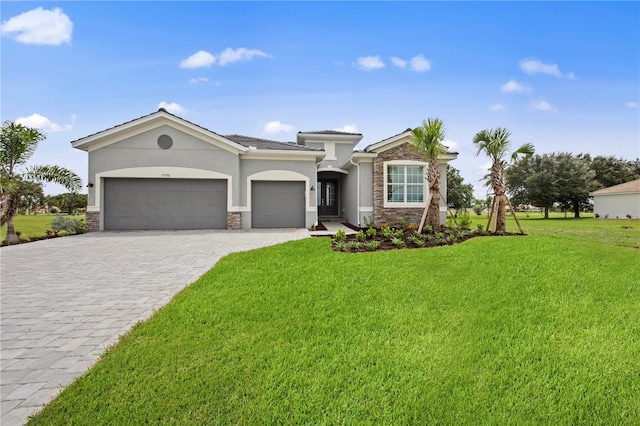 view of front of home featuring a front lawn, a garage, stone siding, and stucco siding