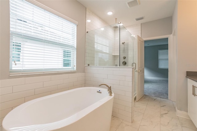 324 37th Ave NE, Saint Petersburg, FL 33704 - bathroom with vanity, marble finish floor, a washtub, visible vents, and a stall shower
