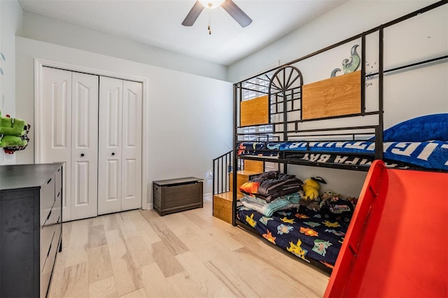 bedroom with a closet, a ceiling fan, and wood finished floors