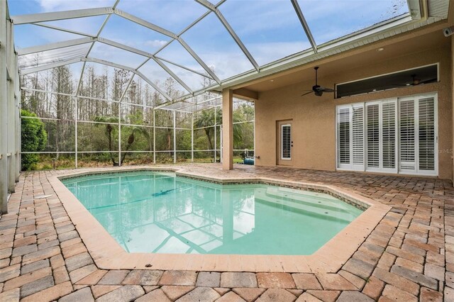 pool featuring ceiling fan, a patio, and a lanai