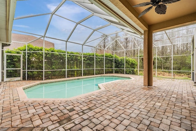 pool featuring ceiling fan, a patio, and a lanai