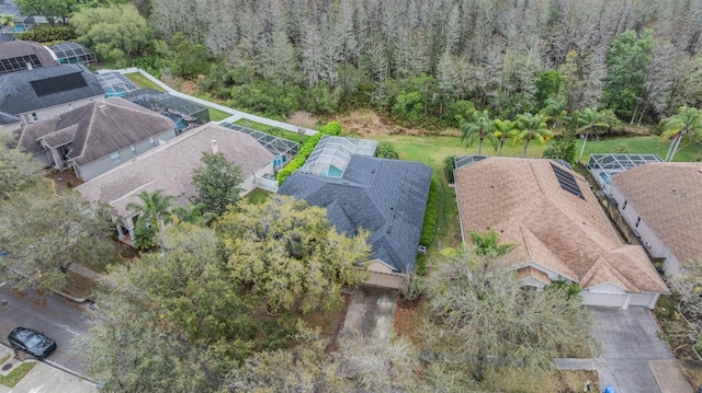 birds eye view of property with a forest view