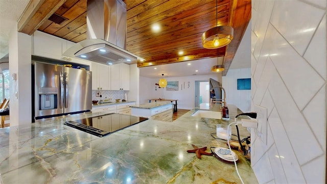 kitchen featuring wood ceiling, island exhaust hood, stainless steel fridge, and a sink